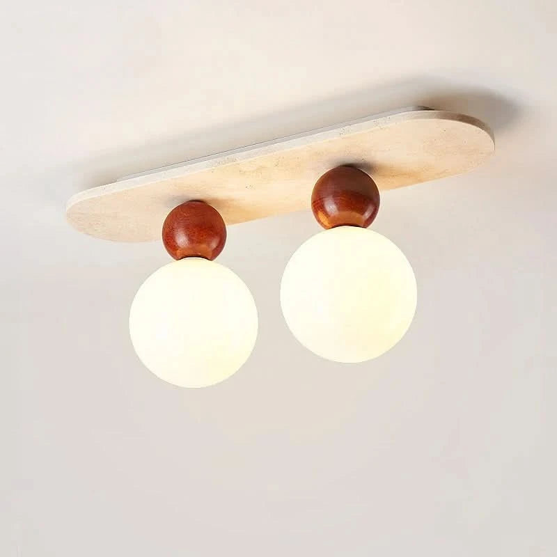 LUMITRAV – Lampada da soffitto ellittica in travertino per interni moderni e morbidi