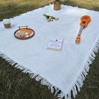 PICNOVA – White Plaid Woven Picnic Mat with Tassel Trim for Outdoor Comfort and Travel Use