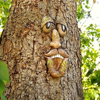 WOODWINK - Whimsical tree face ornament crafted to bring playful character outdoors.