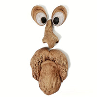 WOODWINK - Whimsical tree face ornament crafted to bring playful character outdoors.